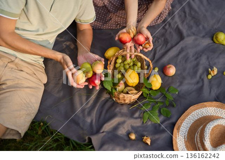 Experiencing tranquil outdoor dining with flavorful seasonal fruits 136162242