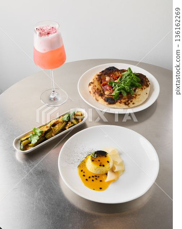 Healthy brunch with roasted vegetable side and cocktail 136162269