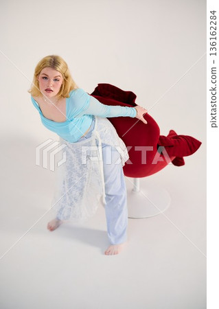 theatrical rehearsal white woman leaning forward from red chair theatrical rehearsal white woman leaning forward from red chair 136162284