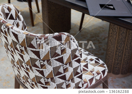 Decorative textured fabric vintage chair with geometric motifs 136162288