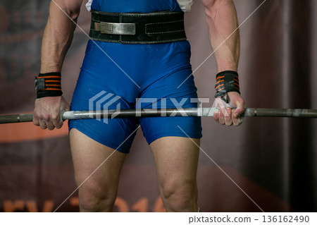 Male athlete hold barbell 136162490