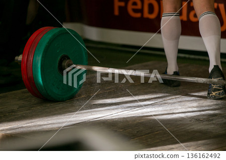 Magnesia in air above barbell 136162492