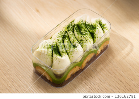 Matcha Banoffee Dessert with Banana and Cream in Soft Natural Shade Matcha Banoffee Dessert with Banana and Cream in Soft Natural Shade 136162781