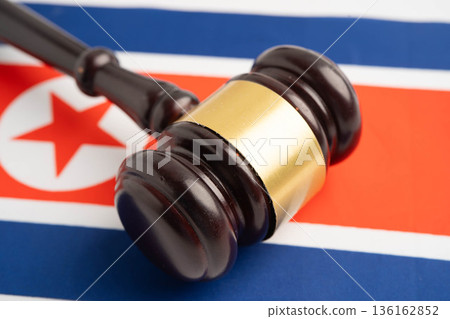 North Korea Legal, justice and agreement, wooden court gavel on flag. North Korea Legal, justice and agreement, wooden court gavel on flag. 136162852