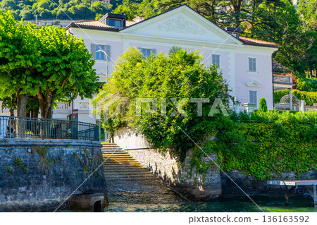 Steps - a launch for boats. Villa houses building architecture on lake Como Italy city on water 136163592