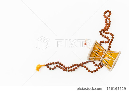 Damru drum and rudraksha mala with spiritual meaning 136165329