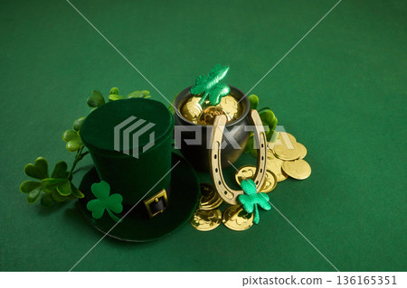 Saint patrick's day leprechaun hat and pot of gold symbolizing luck 136165351