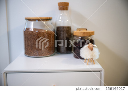 kitchen jars with grains seeds and dried berries with small sheep decor kitchen jars with grains seeds and dried berries with small sheep decor 136166017