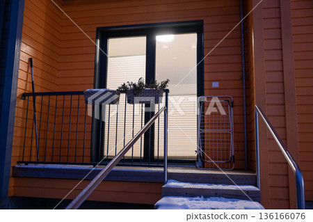 Modern apartment balcony entrance with glass door and winter snow Modern apartment balcony entrance with glass door and winter snow 136166076