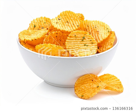 A bowl of crispy potato chips on a white background 136166316