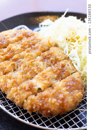 Delicious jumbo minced meat cutlet with sauce and shredded cabbage Delicious jumbo minced meat cutlet with sauce and shredded cabbage 136166530