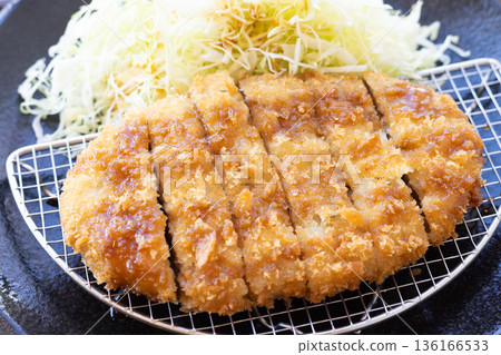 Delicious jumbo minced meat cutlet with sauce and shredded cabbage 136166533