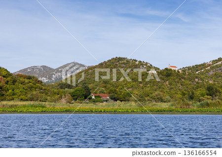 Rijeka Crnojevica, Montenegro. A tranquil riverside scene 136166554