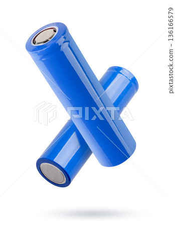 Two lithium-ion batteries flying on a white background. Isolated Two lithium-ion batteries flying on a white background. Isolated 136166579