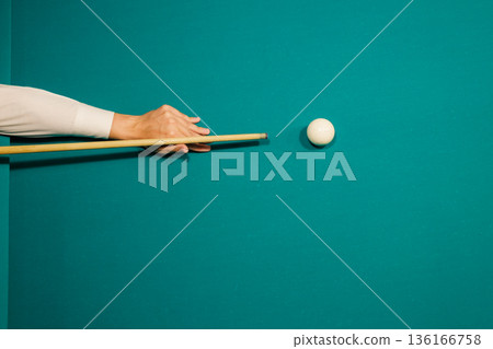 Billiard player play snooker on pool table. 136166758