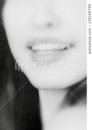 Woman's lips and teeth smiling vintage black and white Woman's lips and teeth smiling vintage black and white 136166799