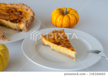 Slice of Homemade Pumpkin Cheesecake 136168083