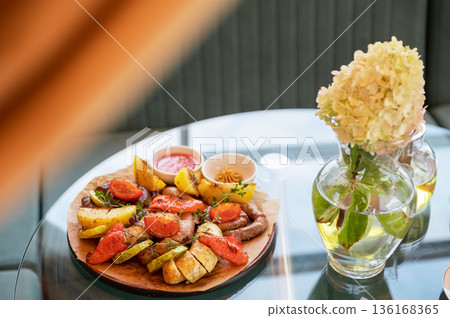 Grilled Sausages with Vegetables and Dipping Sauces Grilled Sausages with Vegetables and Dipping Sauces 136168365