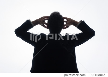 Businessman holding his head Businessman holding his head 136168864