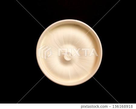 The ice cream on a black background. The ice cream on a black background. 136168918