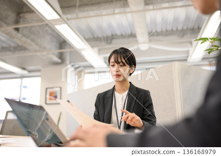 A woman explains during an interview A woman explains during an interview 136168979