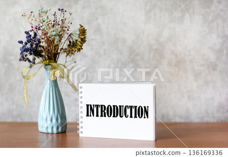 Business concept. An Introduction word written on a notebook Business concept. An Introduction word written on a notebook 136169336