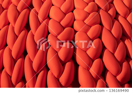 Orange chunky knit pattern creating a warm textile background texture Orange chunky knit pattern creating a warm textile background texture 136169490