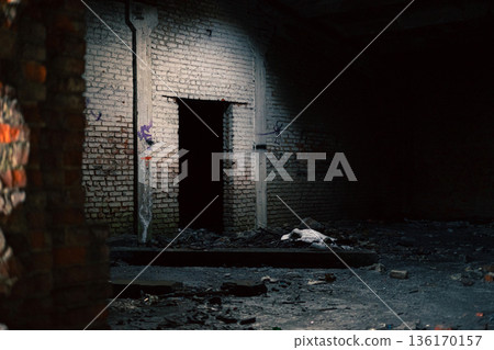 Abandoned Industrial Interior With Dark Doorway Abandoned Industrial Interior With Dark Doorway 136170157