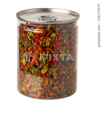 Dried chopped bell peppers in transparent spice jar 136170375
