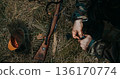 German Soldier hands reloading Mauser rifle with stripper clip during battle simulation German Soldier hands reloading Mauser rifle with stripper clip during battle simulation 136170774