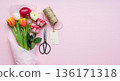 Galentines Day wrapped bouquet with flowers, scissors and gift tag 136171318