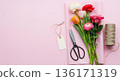 Galentines Day flower bouquet tools and blank tag on pink background 136171319