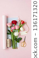 Galentines Day bouquet preparation with pastel paper and flowers 136171320