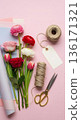 Galentines Day flower wrapping tools and ranunculus on pink background 136171321