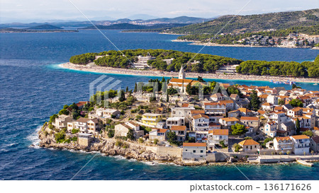 Aerial view of Primosten old town island in Croatia surrounded by Adriatic Sea turquoise water and summer sky 136171626