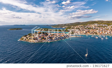 Drone panorama of Primosten Croatia showing historic peninsula marina yachts and turquoise Adriatic water 136171627