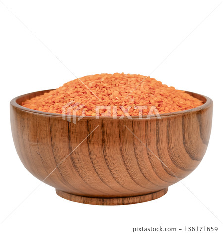 Lentil cereal in a brown wooden bowl isolate on a white background 136171659