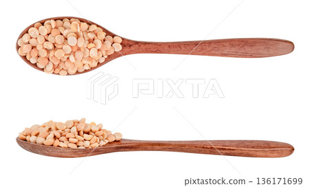 Peas in a brown wooden spoon isolated on white background 136171699