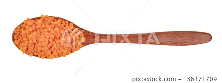 Lentil groats in a brown wooden spoon isolate on a white background Lentil groats in a brown wooden spoon isolate on a white background 136171709