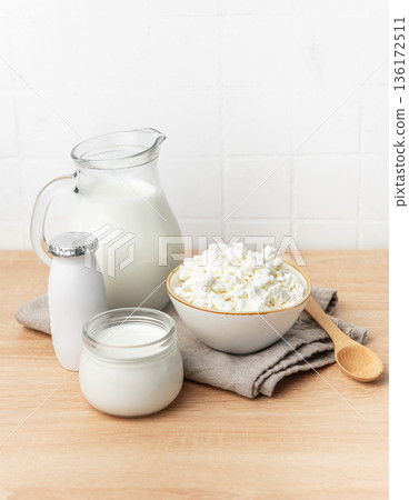 Healthy dairy products offering milk, cottage cheese, and yogurt Healthy dairy products offering milk, cottage cheese, and yogurt 136172511