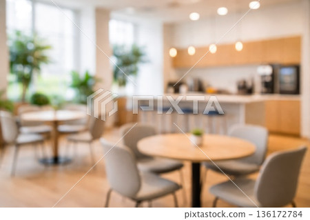 Modern Office Break Room Interior with Tables and Kitchen Area 136172784