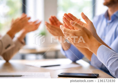 Business Team Applauding During Corporate Meeting in Modern Office 136172830