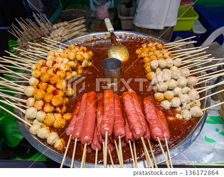 Asian street food skewers in spicy sauce Asian street food skewers in spicy sauce 136172864