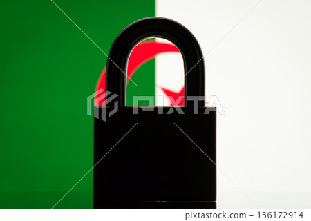 Silhouette of closed lock with flag of Algeria on the background. Concept of closed country Algeria, restrictions, sanctions, ban Silhouette of closed lock with flag of Algeria on the background. Concept of closed country Algeria, restrictions, sanctions, ban 136172914