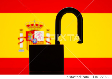 Flag of Spain behind open lock silhouette. Concept of freedom, reopen country, travel, end of pandemic restrictions, bans, open Spain Flag of Spain behind open lock silhouette. Concept of freedom, reopen country, travel, end of pandemic restrictions, bans, open Spain 136172929