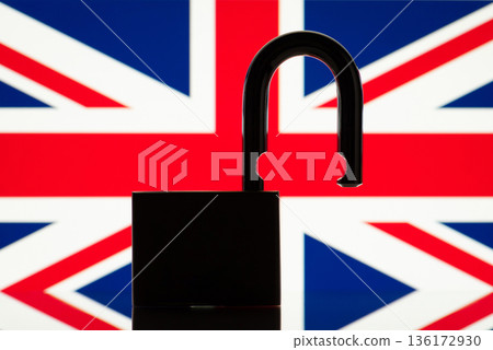 Flag of Great Britain behind open lock silhouette. Concept of freedom, end of restrictions, bans, open Great Britain Flag of Great Britain behind open lock silhouette. Concept of freedom, end of restrictions, bans, open Great Britain 136172930