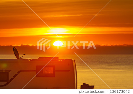 Caravan on sea at sunrise. Caravan on sea at sunrise. 136173042