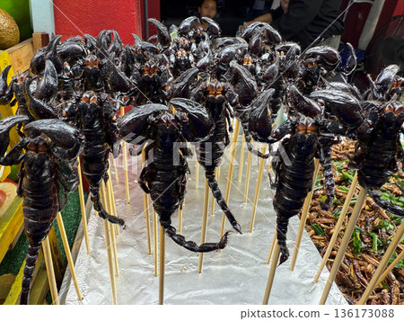 Fried scorpions on skewers Asian street food market 136173088