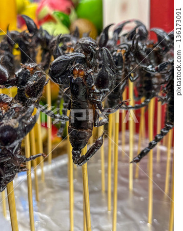 Fried scorpions on skewers Asian street food close up 136173091