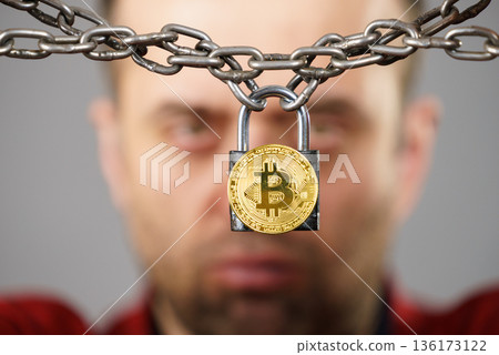Man being tied up in block chain 136173122